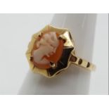 A 9ct yellow gold shell cameo ring, size N+½, approximately 2.95 grams all in.