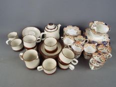 A quantity of teawares comprising Denby 'Potters Wheel' and New Chelsea 'Melton' [2]