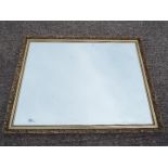 A large wall mirror, approximately 87 cm x 112 cm.
