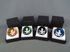 A set of four boxed Baccarat glass cameo paperweights from 'The Royal Cameos In Crystal' series