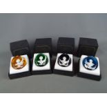 A set of four boxed Baccarat glass cameo paperweights from 'The Royal Cameos In Crystal' series