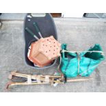 A quantity of gardening tools and accessories, planters and similar.