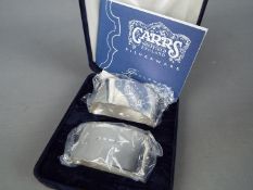 Two hallmarked silver napkin rings, Sheffield assay by Carrs of Sheffield, unused,