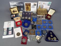 A collection of coins, commemorative crowns and similar, small quantity of stamps,