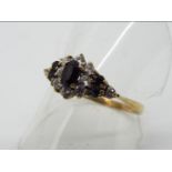 A 9 carat gold ring set with sapphire and cz,