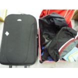 Various luggage, travel bags, hold alls and similar.