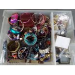 A mixed lot of costume jewellery to include necklaces, brooches earrings and similar,