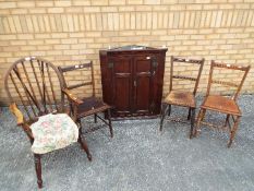 A wall mounted oak corner cabinet and four chairs [5]