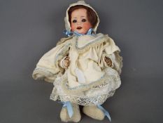 Heubach Doll - a ceramic faced Heubach doll with jointed arms and legs, composition body,