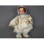 Heubach Doll - a ceramic faced Heubach doll with jointed arms and legs, composition body,