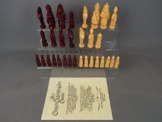 Chess Set - An 'Alice Through The Looking Glass' chess set (one rook missing) by Studio Anne