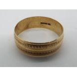 A 9ct gold wedding band, size V, approximately 2.8 grams all in.
