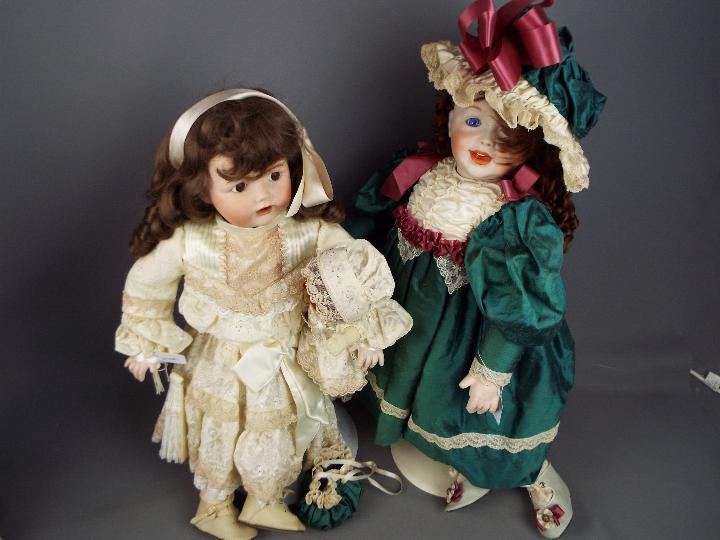 A collection of five beautifully costumed dolls, porcelain heads and hands and fixed glass eyes. - Image 2 of 4