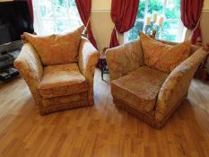 A pair of substantial armchairs finished in red and gold upholstery [2]