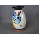 A Lorna Bailey lipped vase in the Bursley Way pattern, approximately 20.