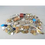 A mixed lot of collectables to include coins, enamelled badges, costume jewellery,