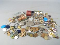 A mixed lot of collectables to include coins, enamelled badges, costume jewellery,