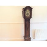 A modern oak cased grand-daughter longcase clock with pendulum and key,