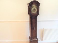 A modern oak cased grand-daughter longcase clock with pendulum and key,