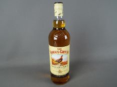 A 1 litre bottle of Famous Grouse 40% ABV