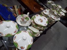 A large collection of Paragon China dinner and tea ware in the 'Rockingham' pattern,