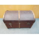 A vintage dome top, wood bound shipping trunk, approximately 50 cm x 77 cm x 50 cm.