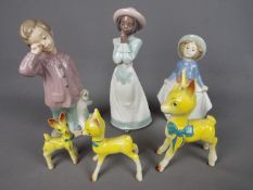 Three Nao figurines, the largest approximately 20.5 cm (h) and three Babycham deer style figurines.