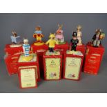 Royal Doulton - Eight boxed Royal Doulton Bunnykins figurines to include 'William Reading Without