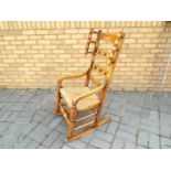 A good quality rocking chair with rush seat.