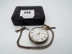 A Victorian silver cased pocket watch, with subsidiary seconds dial, silver watch chain and key.