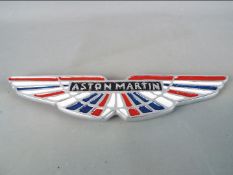 A chrome Aston Martin wall plaque,