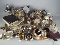 A large quantity of plated ware to include trays, flatware, tazza, coffee pot, tea ware and similar.