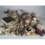 A large quantity of plated ware to include trays, flatware, tazza, coffee pot, tea ware and similar.