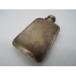 A George V hallmarked silver hip flask with engine turned decoration, Birmingham assay 1920,