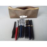 A collection of vintage pens to include Waterman's 515 (14ct nib), Parker Slimfold (14K nib),