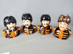 A set of limited edition Beatles character jugs from the Bairstow Manor Collectables collection