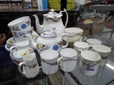 A vintage Paragon China coffee service in the Rose Garden pattern comprising coffee pot,