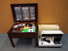 A vintage Pfaff Tiptronic 1029 sewing machine in case and a sewing box with contents.