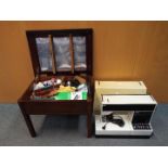 A vintage Pfaff Tiptronic 1029 sewing machine in case and a sewing box with contents.