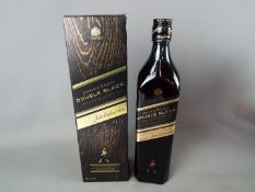 A bottle of Johnnie Walker Double Black 70 cl 43% ABV