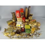 A collection of brassware, shell casings, miner's safety lamp, vintage tins and other.