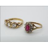 A 9ct gold CZ trilogy ring, size L, and a further 9ct gold cluster ring, size H,