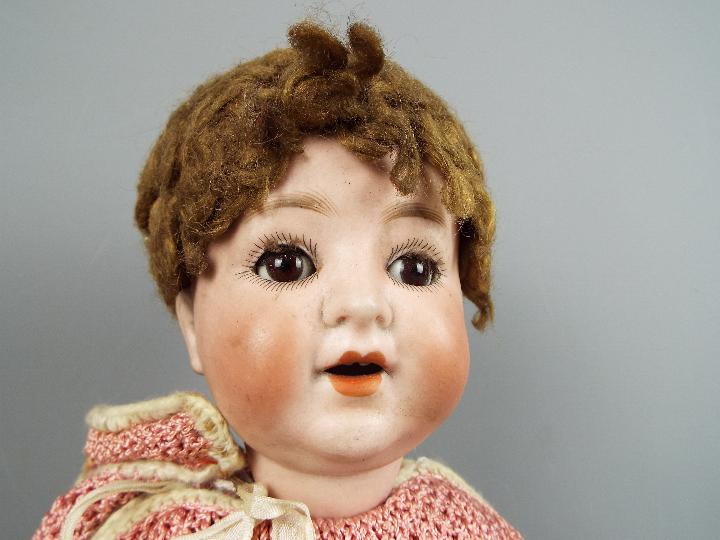 A Schoenau & Hoffmeister character doll with bisque head with sleeping brown eyes, composition body, - Image 2 of 3