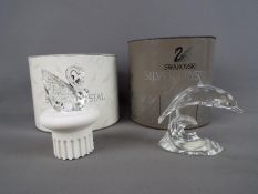 Swarovski - A Swarovski Crystal model entitled 'Dolphin on a Wave' and a 100th Anniversary figure