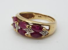 A 9ct gold, garnet and diamond ring, size H, approximately 2.84 grams all in.