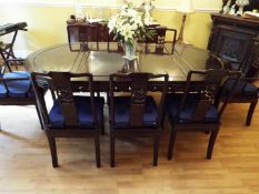 An ebonized dining suite with typical Oriental decoration comprising table 77 cm (h) x 112 cm (w) x