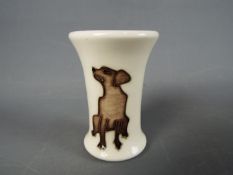 A Moorcroft Labrador vase, approx height 5.