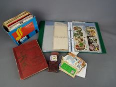 A mixed lot to include stamp album, loose stamps, cigarette cards,