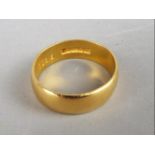 A hallmarked 22ct gold wedding band, size P, approximately 5.