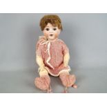 A Schoenau & Hoffmeister character doll with bisque head with sleeping brown eyes, composition body,